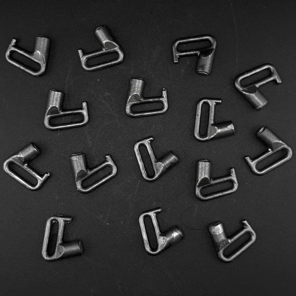 A batch of small cast steel strap clips made for Spencer Aly